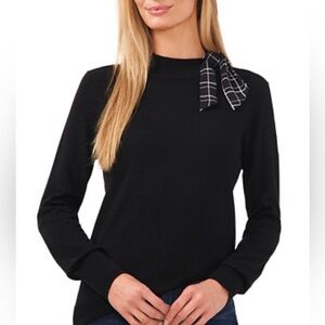 Cece sweater woth printed scarf-like tie detail at the neckline. Size medium.
